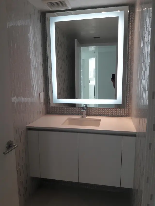 Freestanding soaking tub with tile surround