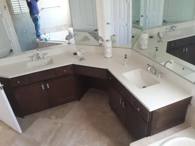 Floor-to-ceiling white pantry wall with built-in refrigerator
